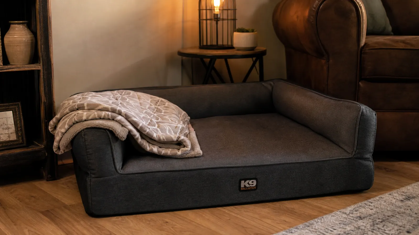 Orthopedic dog bed with memory foam in a cozy living room corner with warm lamp light